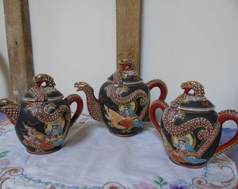 Hand Painted Japanese Dragon three piece tea set. Tea pot, measures 15cm high, 18cm across the others both measure