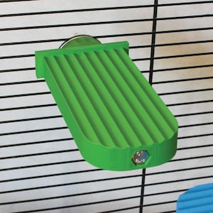 May include: A bright green, ribbed pet cage platform. The platform is rectangular with rounded edges and a textured surface. It is attached to a metal cage with a silver mounting bracket. The platform is designed for small pets.