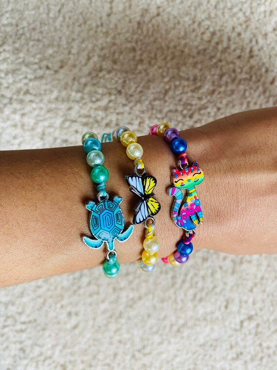 Sliding knot bracelet with charm clearance