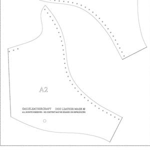 May include: A white paper pattern for a dog leather mask. The pattern includes multiple pieces with dotted lines for stitching and the text "A2". The text "GAJUSLEATHERCRAFT DOG LEATHER MASK" is also visible.