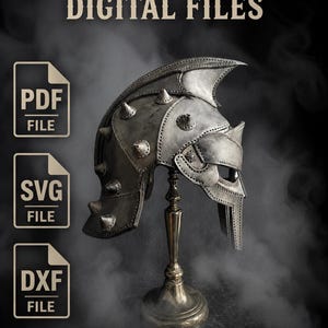 Puede incluir: Un casco plateado con púas, exhibido en un soporte decorativo. La imagen incluye el texto "DIGITAL FILES" e iconos para los formatos de archivo PDF, SVG y DXF, lo que sugiere archivos de diseño digital.