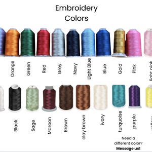 May include: An image showcasing a variety of embroidery thread colors. The image is labeled "Embroidery Colors" and displays spools of thread in shades like lavender, orange, green, red, grey, navy, light blue, blue, gold, pink, and light pink. Additional colors include white, black, sage, maroon, brown, clay brown, ivory, turquoise, purple, and yellow.