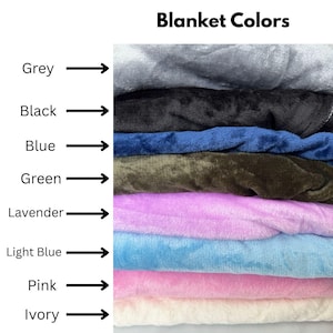 May include: A stack of plush blankets in various colors, including grey, black, blue, green, lavender, light blue, pink, and ivory. The text "Blanket Colors" is at the top of the image.