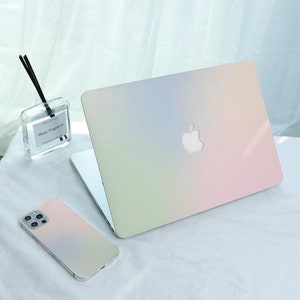 Könnte beinhalten: Ein Set aus drei Keramikbechern mit gesprenkelter, matter Oberfläche. Die Becher sind in Creme-, Hellgrau- und Dunkelgrautönen gehalten. Jeder Becher hat ein schlichtes, minimalistisches Design, perfekt für Kaffee oder Tee.