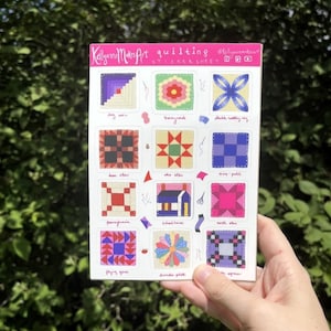 May include: A sticker sheet with 16 different quilting block designs. Each block is a different color and pattern. The sticker sheet is titled "Kellyanne Makes Art quilting sticker sheet".