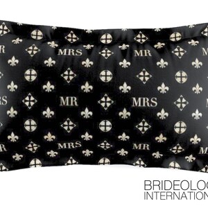 May include: Black and white pillow with a repeating pattern of fleur-de-lis and the words "MR" and "MRS".