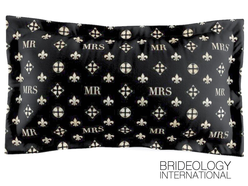 May include: Black and white pillow with a repeating pattern of fleur-de-lis and the words "MR" and "MRS".