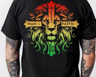 May include: Black t-shirt with a lion's head graphic in red, yellow, and green colors. The lion's head is surrounded by a cross with the words "Man of Faith" and "1 Corinthians 15:13".