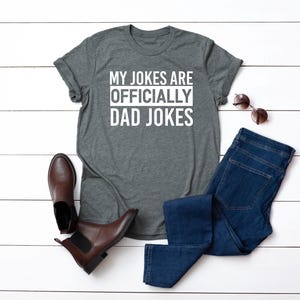 a t - shirt that says, my jokes are officially dad jokes
