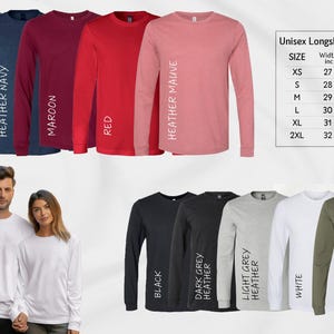a man and woman standing next to each other wearing long sleeve shirts