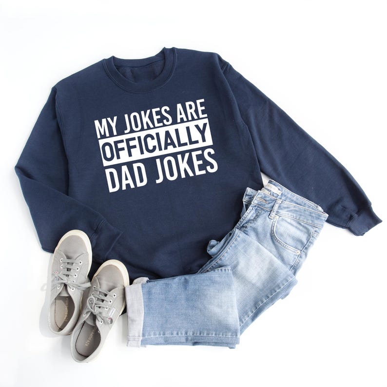 a sweatshirt that says, my jokes are officially dad jokes