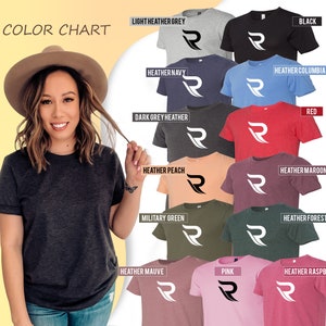 May include: Color chart showing 12 different t-shirt colors with a white stylized letter 'R' on each shirt. The colors are: light heather grey, black, heather navy, heather columbia blue, red, dark grey heather, heather peach, heather maroon, military green, heather forest, heather mauve, pink, and heather raspberry.