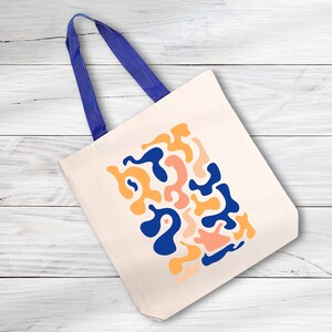 a tote bag on a white wooden surface