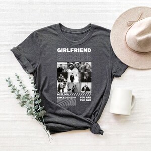 a t - shirt with a picture of a group of people on it