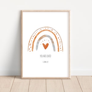 May include: A watercolor rainbow with a heart in the center and the text "You are loved" and "1 John 4:19" below. The rainbow is in shades of orange, brown, and gray.