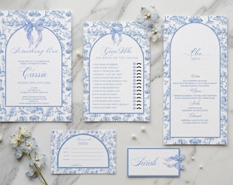 Puede incluir: Un conjunto de papelería de boda con un patrón toile de jouy azul y blanco, marcos arqueados e ilustraciones de lazos. La colección incluye una invitación para Cassie, un juego Guess Who, un menú, una tarjeta de notas y un tarjetero para Sarah.