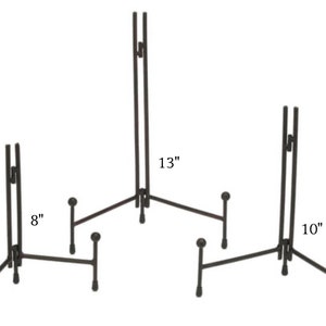 May include: Three black metal easel stands of different sizes. The largest stand is 13 inches tall, the middle stand is 10 inches tall, and the smallest stand is 8 inches tall.