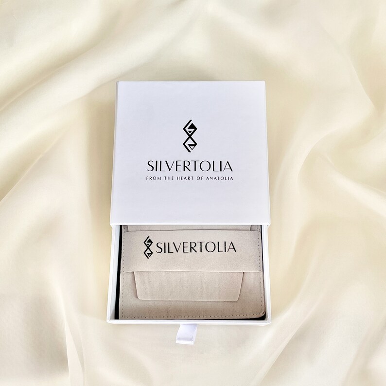 Our standard jewelry packaging includes a sponge filled safe drawer box and a suede pouch which you can use to store and clean your jewelry.