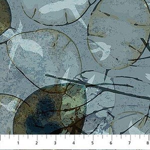 May include: Textile featuring a repeating pattern of large, overlapping, semi-transparent, circular shapes in shades of blue, green, and brown. White leaf-like shapes and dark brown branch-like lines are scattered across the surface. A ruler with inch measurements is at the bottom.