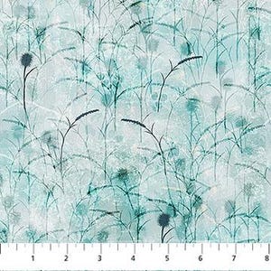 May include: A fabric with a repeating pattern of stylized, dark teal and black plant silhouettes against a light blue and white mottled background. The image includes a ruler along the bottom, marked in inches.