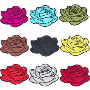 May include: Set of ten embroidered iron-on patches featuring roses in various colors, including red, pink, blue, green, brown, black, yellow, and gray.