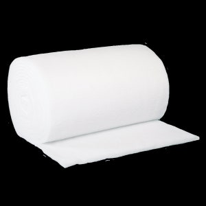 Può includere: Un rotolo di materiale filtrante bianco per acquari o altri sistemi di filtrazione.