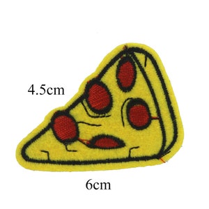 May include: Embroidered pizza slice patch. The patch is yellow with red pepperoni and black outlines. It measures 6 cm by 4.5 cm.