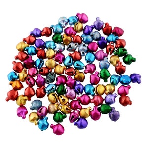 May include: A large assortment of colourful metal jingle bells. The bells are in various shades of red, green, blue, gold, silver, and purple.