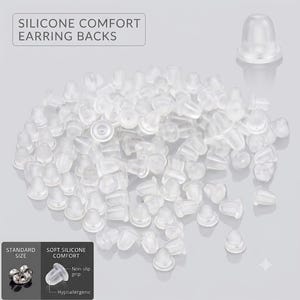 May include: A large collection of translucent, dome-shaped silicone earring backs. The image includes the text SILICONE COMFORT EARRING BACKS, STANDARD SIZE, SOFT SILICONE COMFORT, Non-slip grip, and Hypoallergenic, with a single back shown.