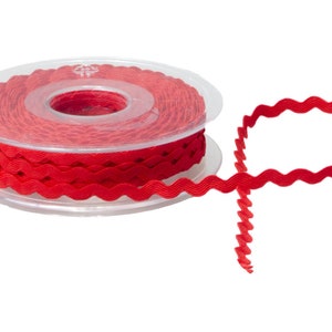 May include: A spool of red, wavy trim ribbon. The ribbon is on a clear plastic spool.
