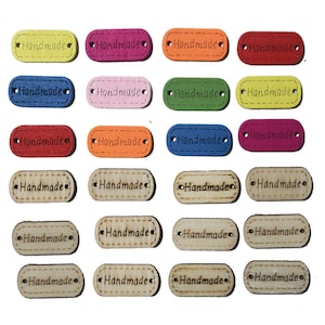 May include: Twenty wooden oval tags with the word "Handmade" written on them. The tags are in various colors, including yellow, red, orange, pink, blue, green, and brown.
