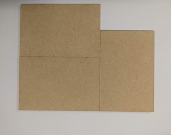 May include: Four rectangular pieces of brown particle board, arranged in a grid pattern.