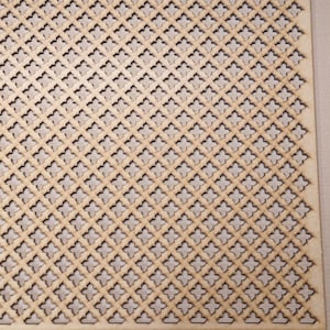 May include: A close-up of a light brown wooden panel with a repeating pattern of diamond-shaped cutouts. The cutouts are arranged in a grid pattern, creating a decorative and airy effect.