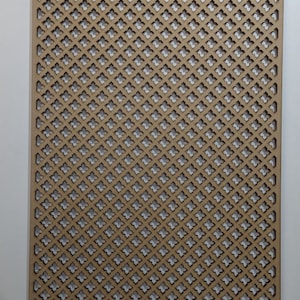 May include: A brown wooden lattice panel with a repeating geometric pattern of small, diamond-shaped cutouts. The panel is made of thin wood and has a light brown color.