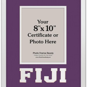 May include: White framed photo frame with a purple mat. The frame is designed for an 8" x 10" certificate or photo. The word "FIJI" is displayed in white block letters at the bottom of the frame.