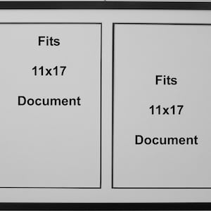 May include: Black picture frame with two openings, each with a white mat. The text "Fits 11x17 Document" is printed in black on each mat.