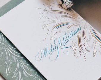 Tarjeta de Navidad personalizada: Tarjeta navideña hecha a mano con lámina dorada y caligrafía.