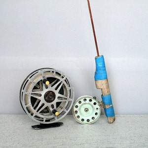 Vintage fishing rod and 2 old reels