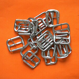 Belt buckles, Vintage small silvercolor buckles 84 pcs.