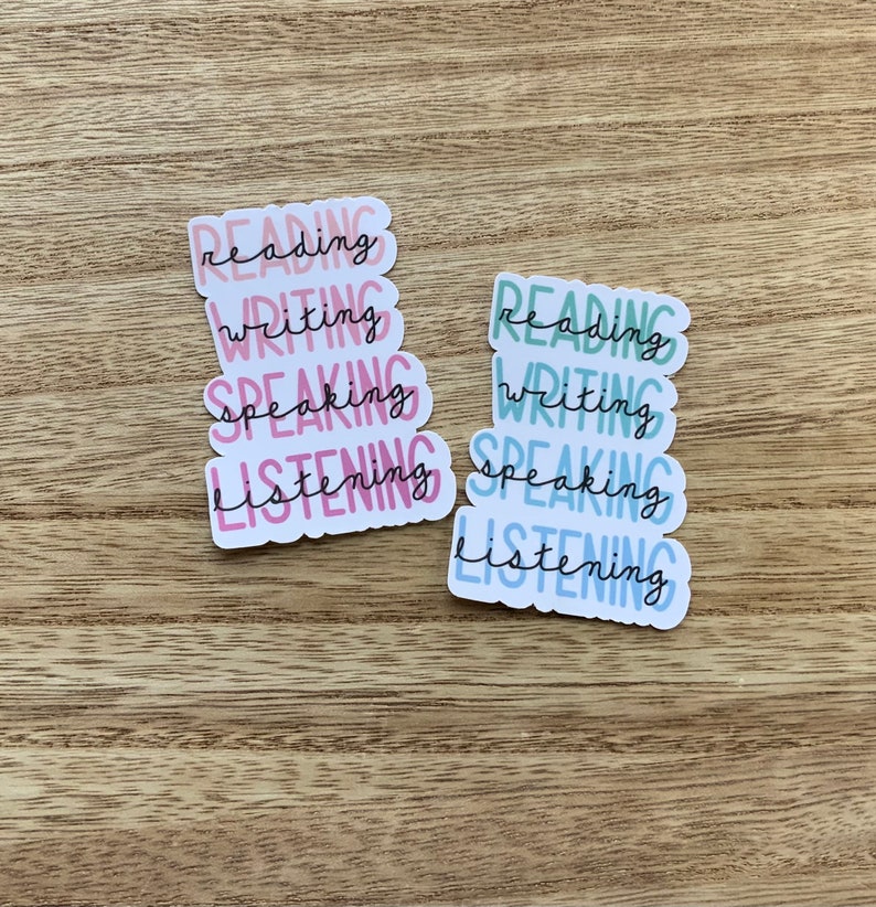 May include: Two sets of stickers with the words "reading", "writing", "speaking", and "listening" in a stacked format. The stickers are in pink, blue, and green.