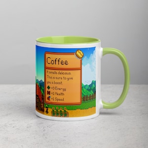 May include: A white coffee mug with a green rim and handle. The mug features a pixelated image of a coffee bean and a text box that reads "Coffee" and "It smells delicious. This is sure to give you a boost. +3 Energy +1 Health +1 Speed".