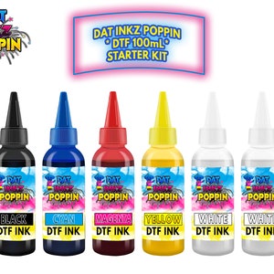 May include: A set of six bottles of DTF ink in black, cyan, magenta, yellow, and two white bottles. The bottles are labeled "DAT INKZ POPPIN" and the ink colors are printed below each bottle. The text "DTF 100mL STARTER KIT" is printed above the bottles.