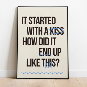 May include: A black framed poster with a white background and black text that reads "It started with a kiss how did it end up like this?" with a blue circle around the words "kiss" and "end up".