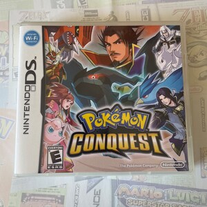 May include: A Nintendo DS game cartridge for Pokemon Conquest. The game features a colourful illustration of Pokemon characters and a warrior in a red and black outfit. The game's title, "Pokemon Conquest", is displayed in large, bold letters.