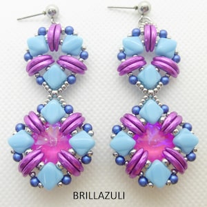 May include: A pair of handmade earrings with a geometric design. The earrings feature light blue, purple, and silver beads arranged in a layered pattern. The center of each earring has a pink iridescent bead. The word "BRILLAZULI" is printed at the bottom.
