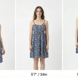 May include: Three women wearing blue floral print dresses with spaghetti straps. The dresses have a fitted bodice and a flared skirt. The women are standing in front of a white background. The dresses are 34 inches in length.