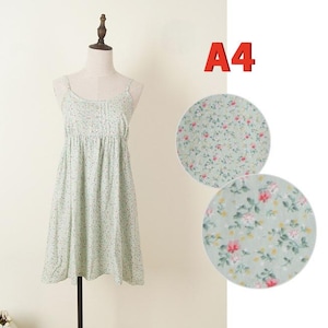 May include: A light green floral print dress with spaghetti straps displayed on a mannequin. The dress has a gathered bodice and a flared skirt. Two circular fabric swatches with the same floral pattern are shown next to the dress. The text "A4" is in the upper right corner.