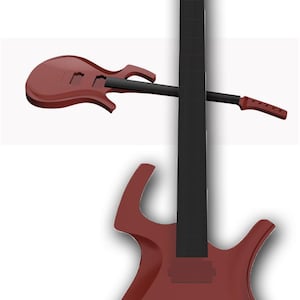 Pode incluir: Uma guitarra elétrica vermelha com um formato de corpo único e um braço preto. A guitarra tem um único captador e uma ponte com uma barra de tremolo.