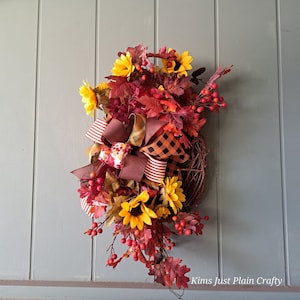 Fall sunflower front door decor. Woodsy wreath for your patio decor. Fall wreath for front door.  Lots of berries and autumn leaves