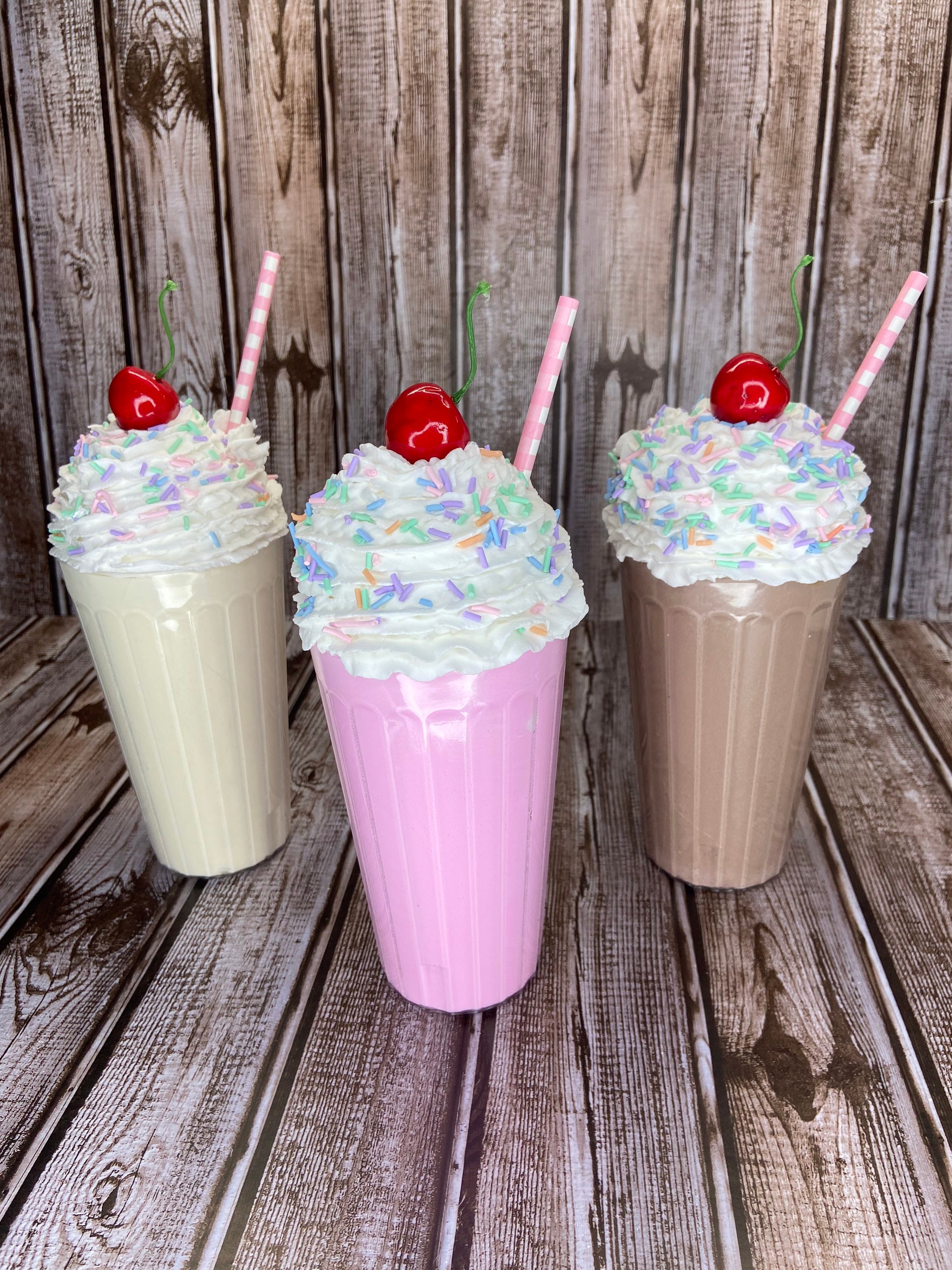 strawberry milkshakes with funny face straw toppers